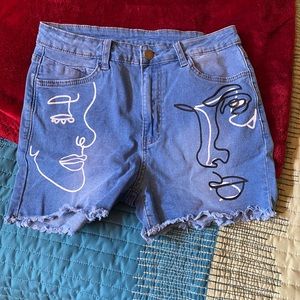 Artsy face on jean shorts